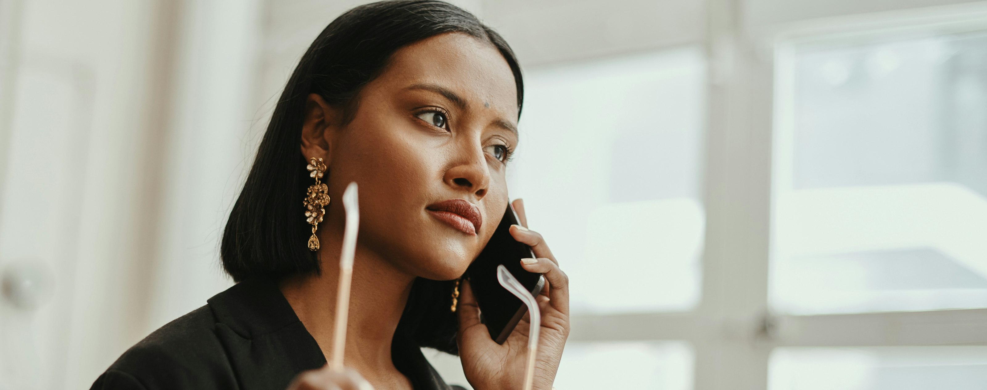 A woman on a call on her smartphone